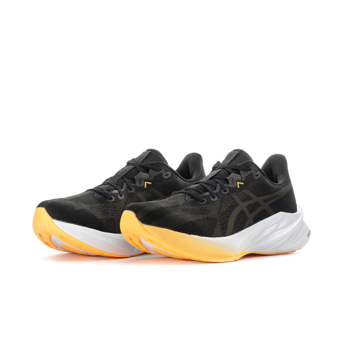 Men's black lace-up running shoes with white midsole and orange tread accents