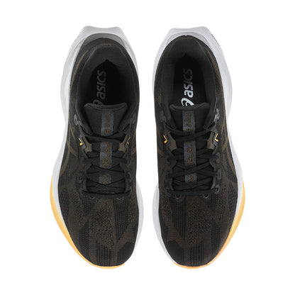 Men's black running shoes, top view showing padded tongue and lace-up interior