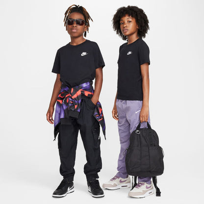Youth black t-shirt with embroidered Nike logo, worn with loose pants