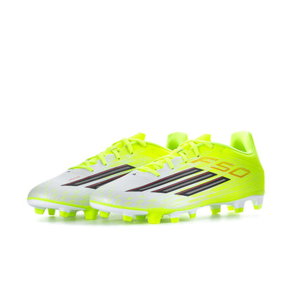 Men's soccer cleat pair in neon yellow with black and red logo details