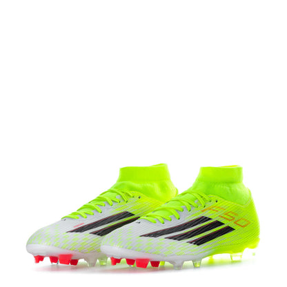 Neon green mens soccer cleats, side view with black stripes and red-tipped molded studs