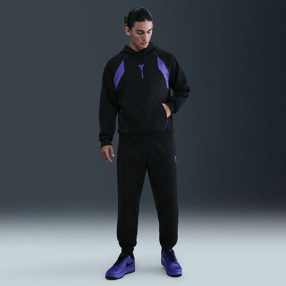 Men's black hoodie with purple raglan panels and drawstring hood.