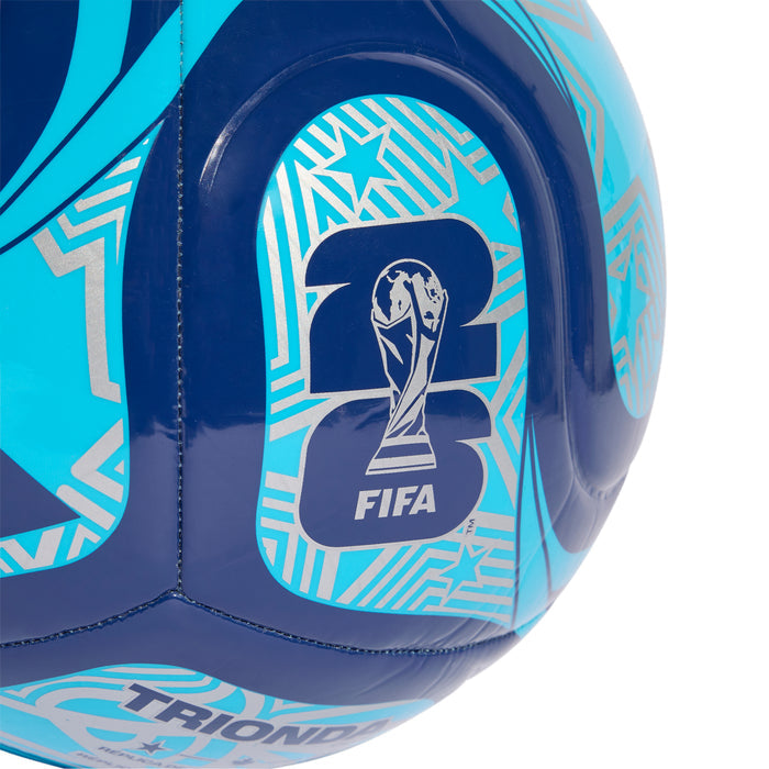 Trionda club ball close-up of FIFA crest on navy-blue panel with cyan accents.