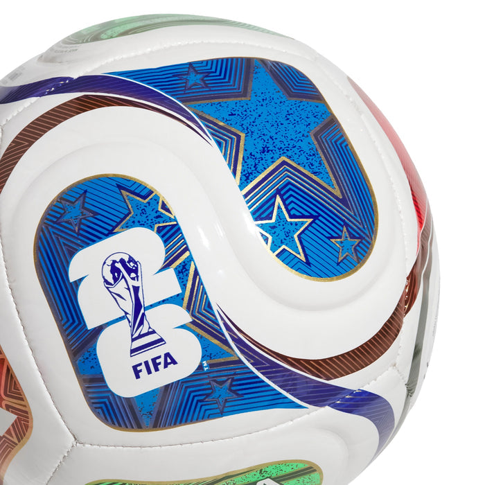 Mini+ football close-up, blue star and FIFA player emblem on white surface