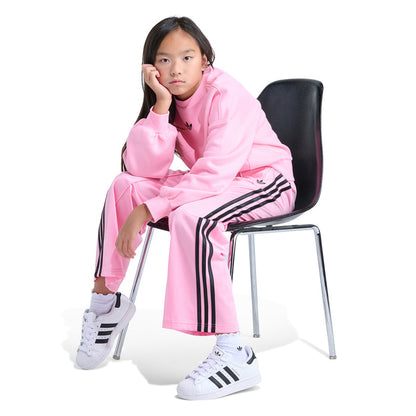 Youth light pink track pants with black side stripes, relaxed fit, elastic cuffs