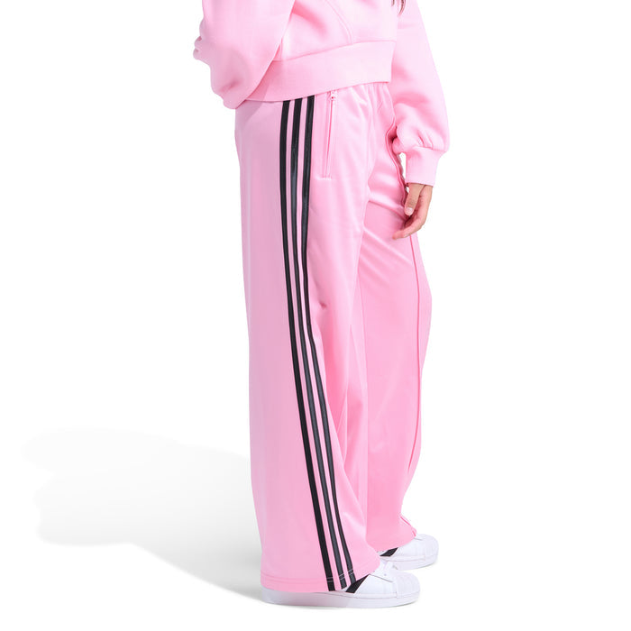 Youth light pink track pants with black side stripe trim and side pocket opening