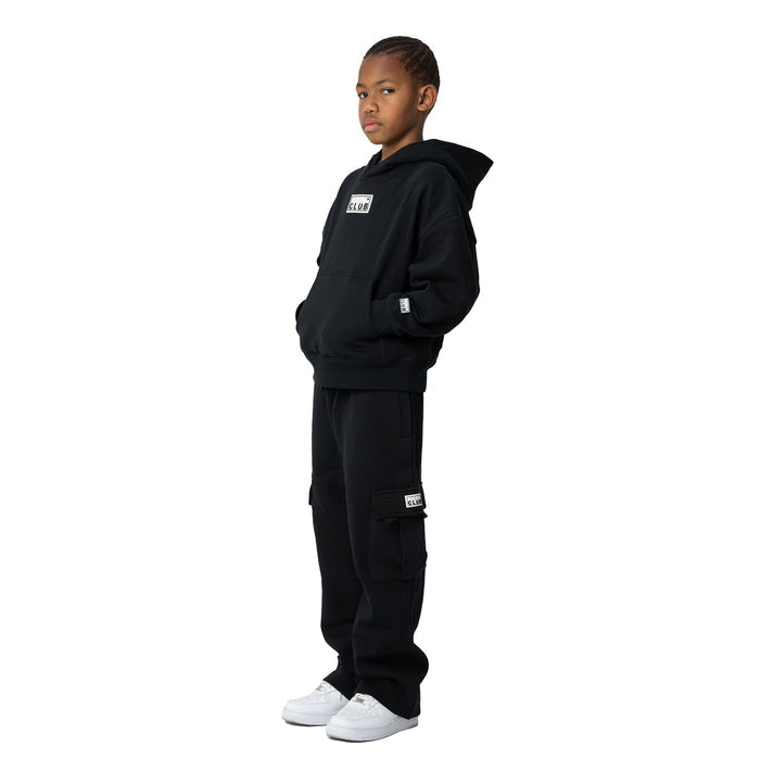 Youth black fleece cargo sweatpants on model, side view with drawstring waist