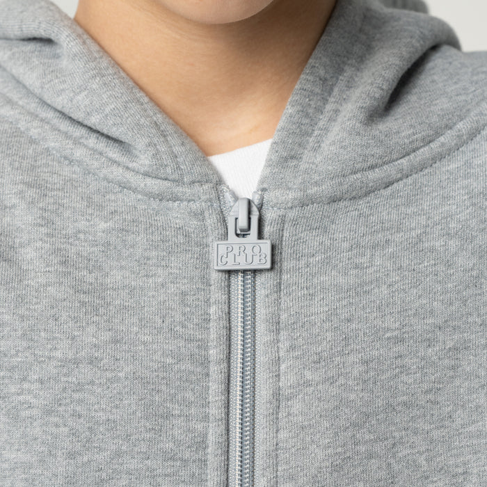 Heather grey hoodie close-up: front zipper pull with small logo patch