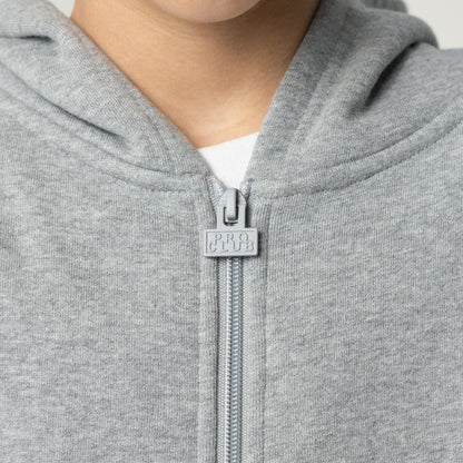 Heather grey hoodie close-up: front zipper pull with small logo patch
