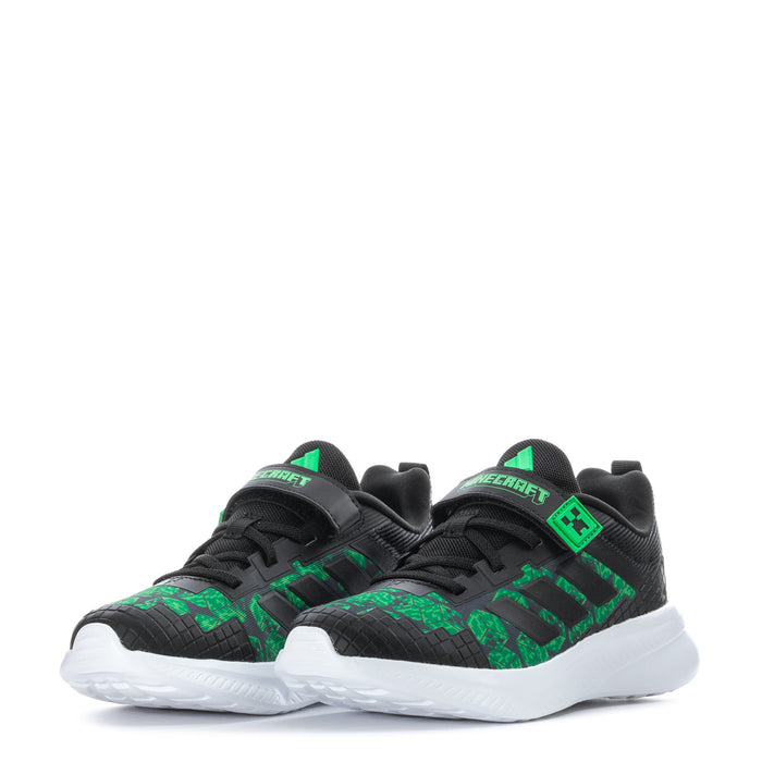 Pair of kids' black sneakers with green pixel patterns and white cushioned soles