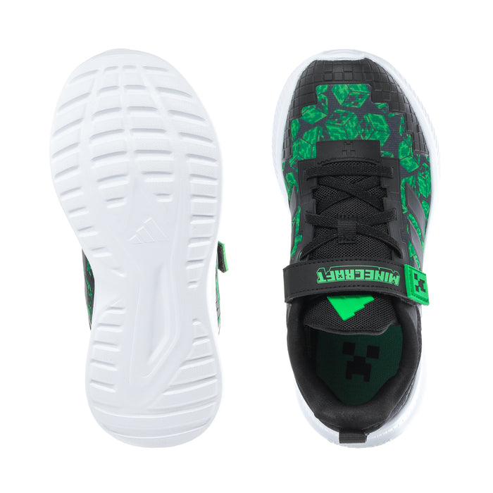 Kids' black-and-green sneakers: white outsole tread and textured upper panel