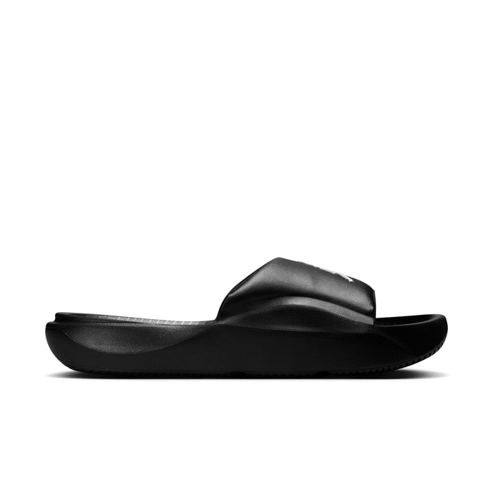 Black slide sandal with cushioned strap and textured sole; side view