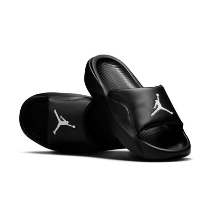 Black slide sandals angled view, white Jumpman logos on two straps