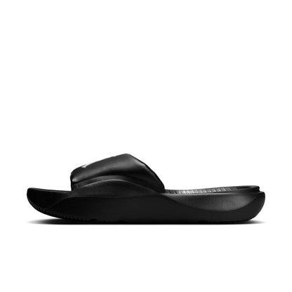 Black slide sandal, low-profile sole and cushioned strap with textured surface