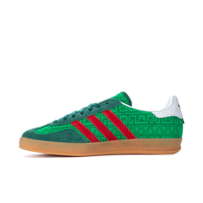 Green men's indoor sneaker with red three stripes, patterned upper, gum sole.