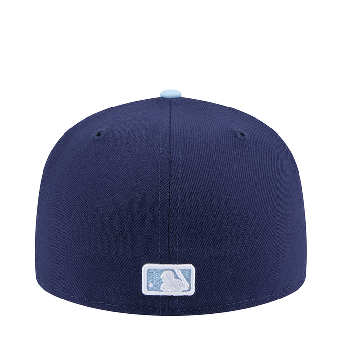 Two-tone baseball cap in dark navy with light blue brim and baseball glove patch
