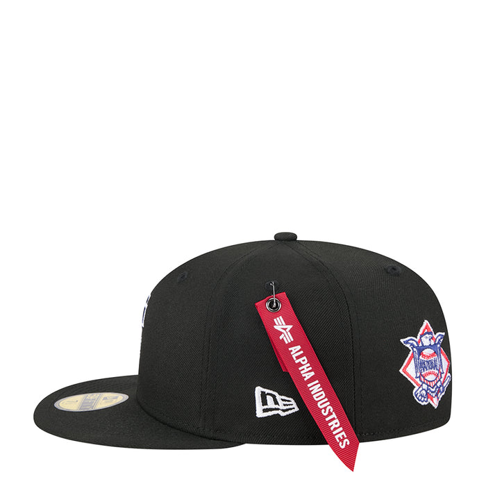 Black baseball cap with red Alpha Industries ribbon and blue team logo