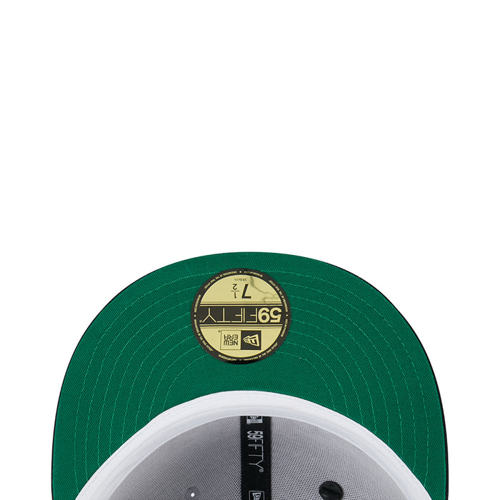 Green baseball cap crown close-up with circular size label patch