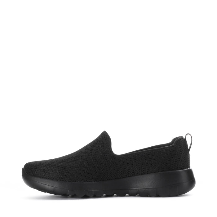 Women's black slip-on walking shoes, side view with flexible knit upper and thick sole