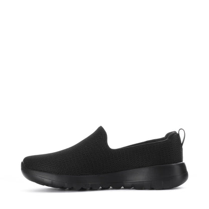 Women's black slip-on walking shoes, side view with flexible knit upper and thick sole