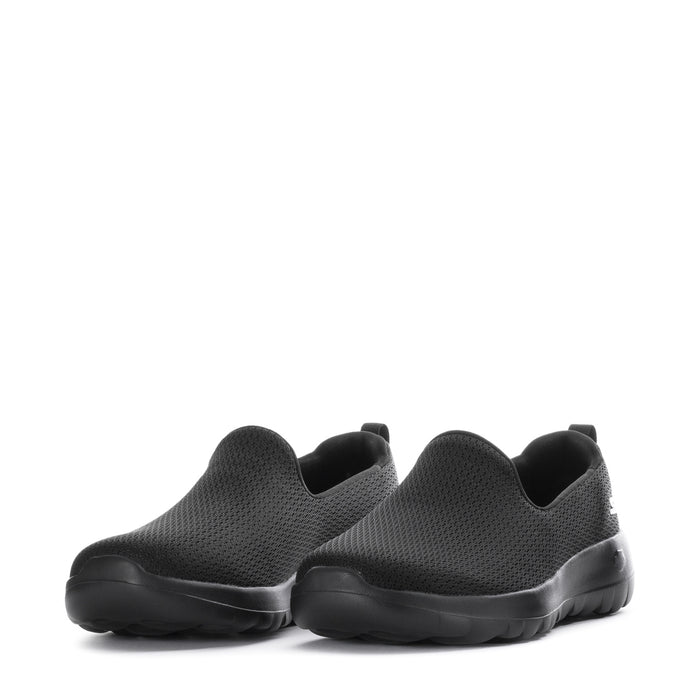 Women's black slip-on walking shoes, front view pair with stretch knit upper