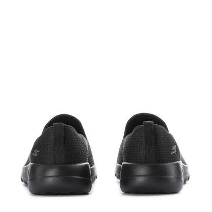 Women's black slip-on walking shoes, heel view with logo detail on back