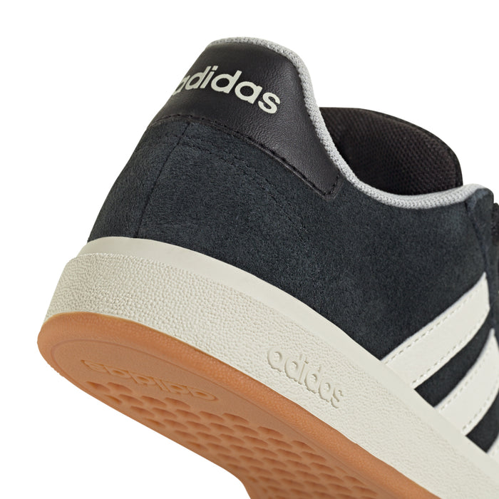 Kids adidas Grand Court upper close-up, black suede with white stripe and gum sole