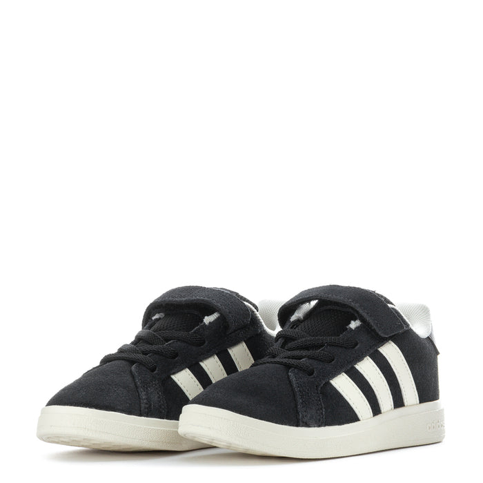 Pair of black toddler sneakers with white stripes and hook-and-loop strap