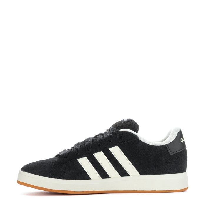 Black Adidas sneakers with white stripes and gum outsole, front-side angle.