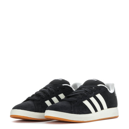 Pair of black Adidas sneakers with white stripes and gum outsole, front view.