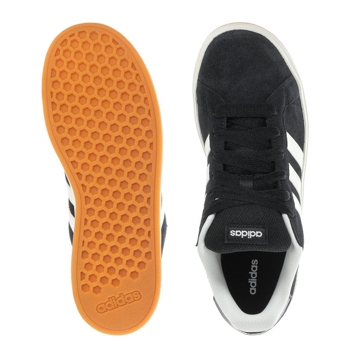Black Adidas sneakers with white interior, gum outsole tread and heel label.