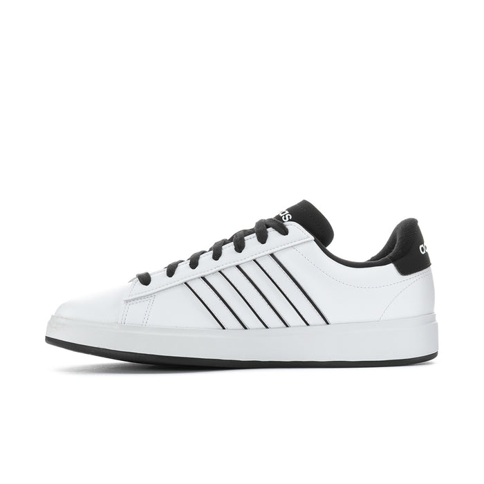 Men's adidas low-top sneakers in white with black stripes and lace-up closure.
