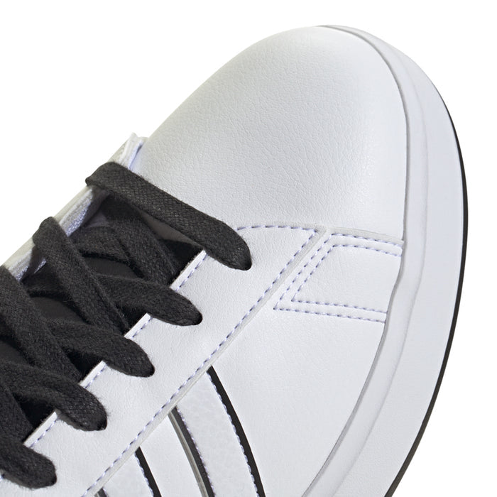 Men's adidas sneaker upper close-up with black laces, stitching, and striped panels.