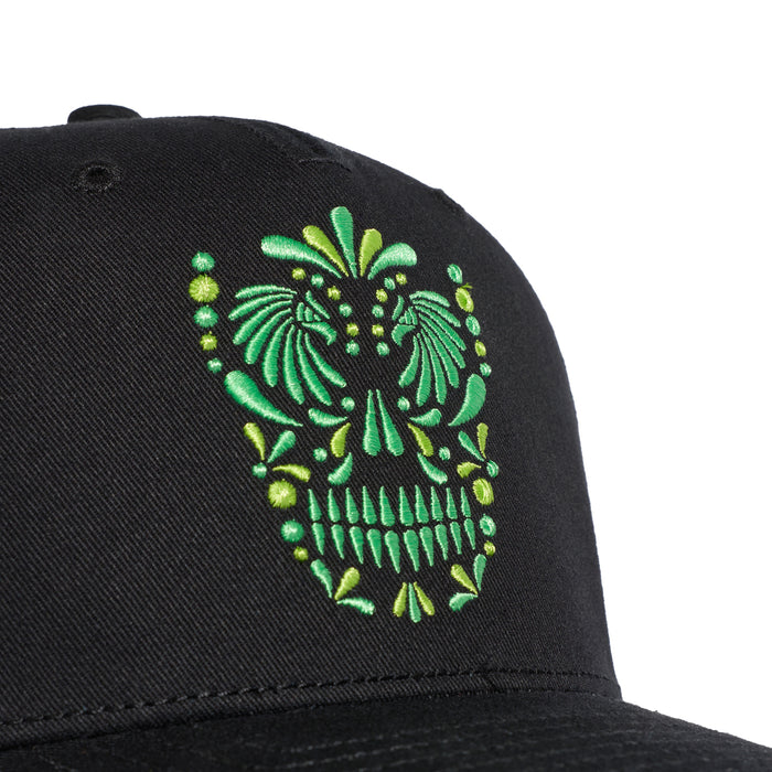 Black cap with green sugar skull embroidery on front panel