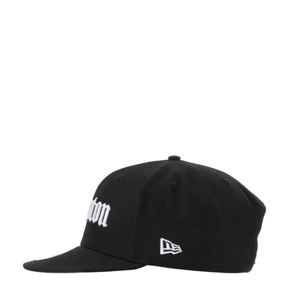 Black snapback cap with white side logo and New Era emblem