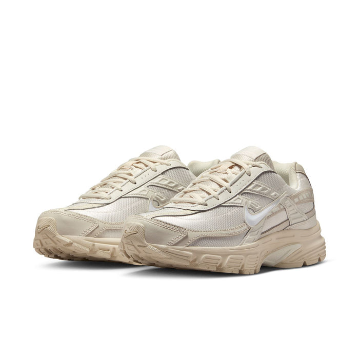 Womens running sneaker pair, light orewood brown and sail, angled side view with laces