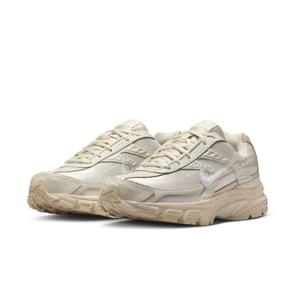 Womens running sneaker pair, light orewood brown and sail, angled side view with laces