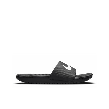 Youth black slide sandals with white Nike swoosh, textured footbed and sole