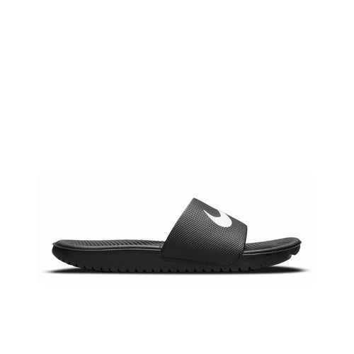 Youth black slide sandals with white Nike swoosh, textured footbed and sole