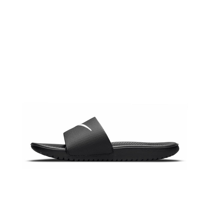 Youth black slide sandals with white swoosh and ridged sole