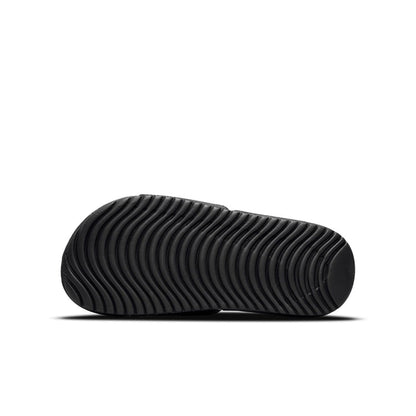 Youth black slide sandal outsole with grooved tread