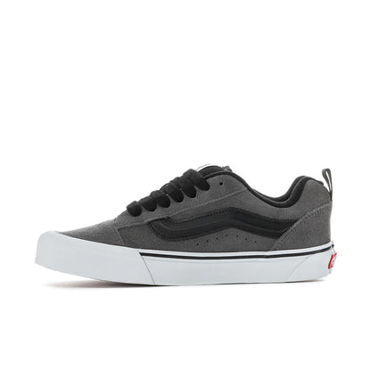 Men's suede sneaker side view in pewter gray with black laces and white platform sole