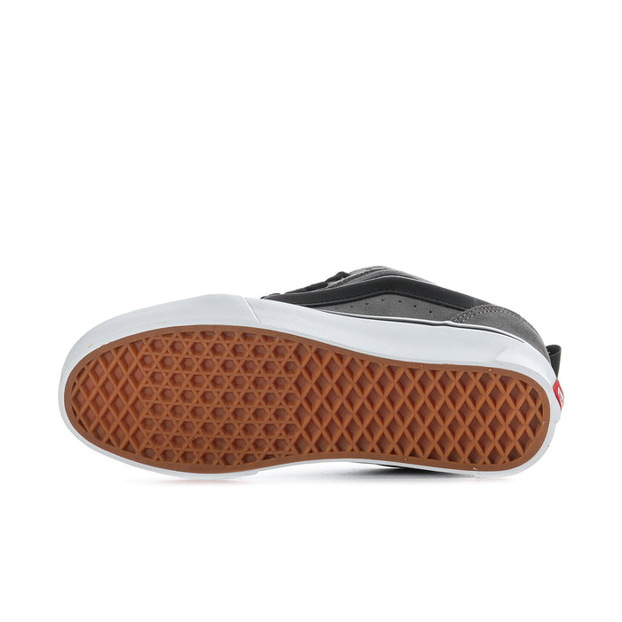 Men's sneaker outsole tread in brown rubber under pewter gray shoe