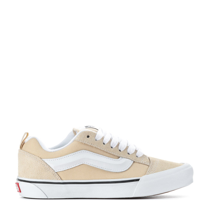 Beige and white low-top women's sneakers with white laces and light blue side stripe