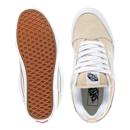 Beige low-top women's sneakers with white laces; brown textured outsole and white sole