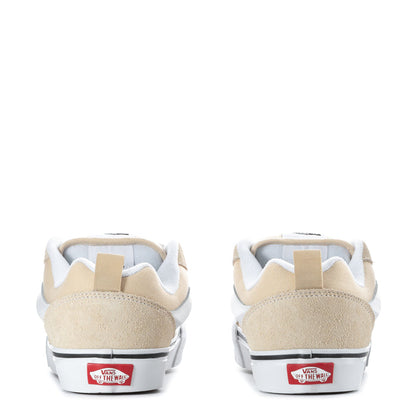 Back view of beige and white low-top women's sneakers with Vans heel labels