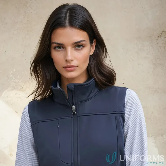 Woman wearing dark blue Ladies U:Tech SoftShell Vest from Biz Collection Womens softshell vest j29123