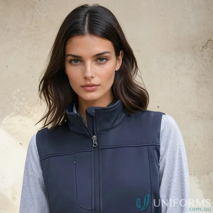Woman wearing dark blue Ladies U:Tech SoftShell Vest from Biz Collection Womens softshell vest j29123