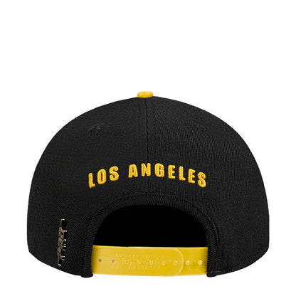 Black snapback baseball cap showing adjustable back strap and yellow Los Angeles text