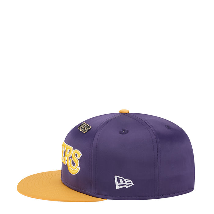 Two-tone satin cap: purple crown, gold brim, New Era side logo